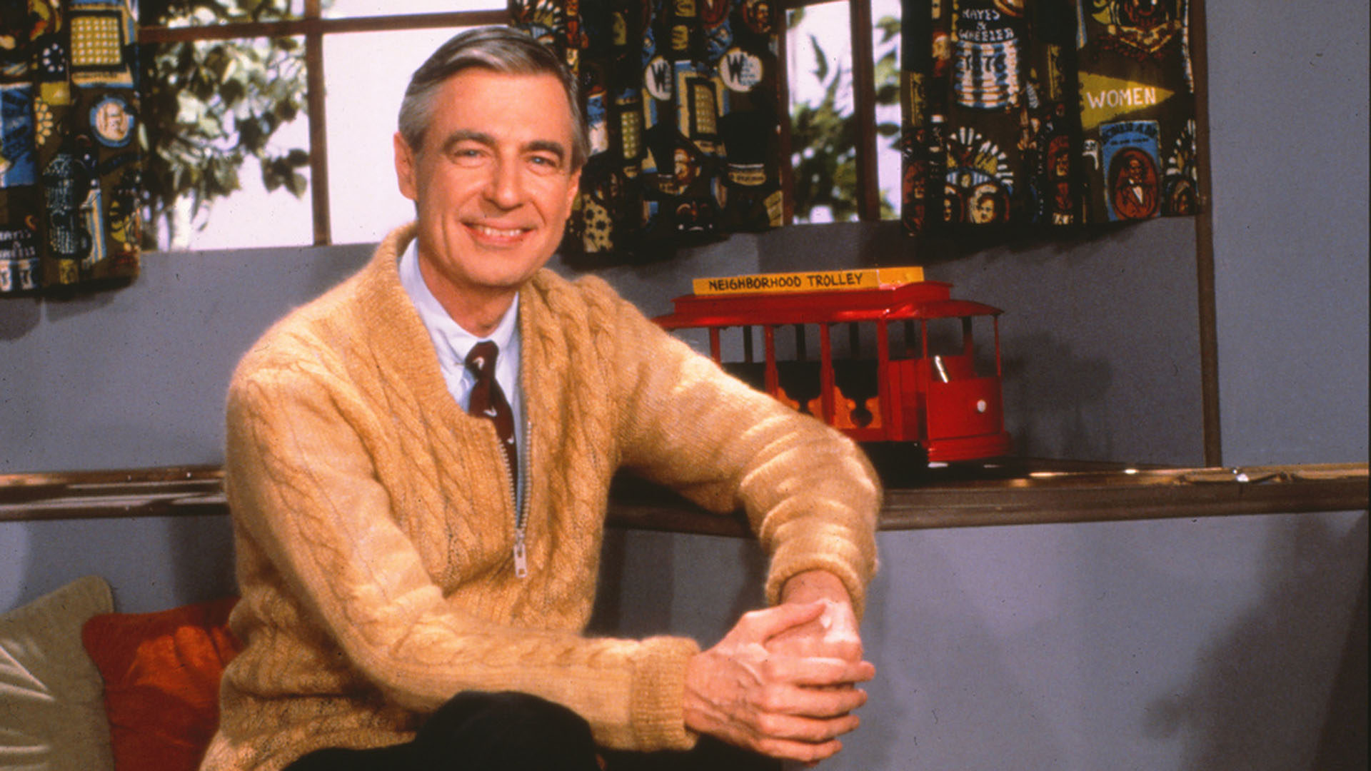 Fred Rogers on set of Mister Rogers' Neighborhood holding a puppet named King Friday XIII